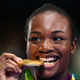 Gold medalist Claressa Maria Shields poses on the podium during the medal ceremony for the Women’s Boxing Middle on day 16 of the Olympic Games on Aug. 21, 2016, in Rio de Janeiro.
Alex Livesey/Getty Images